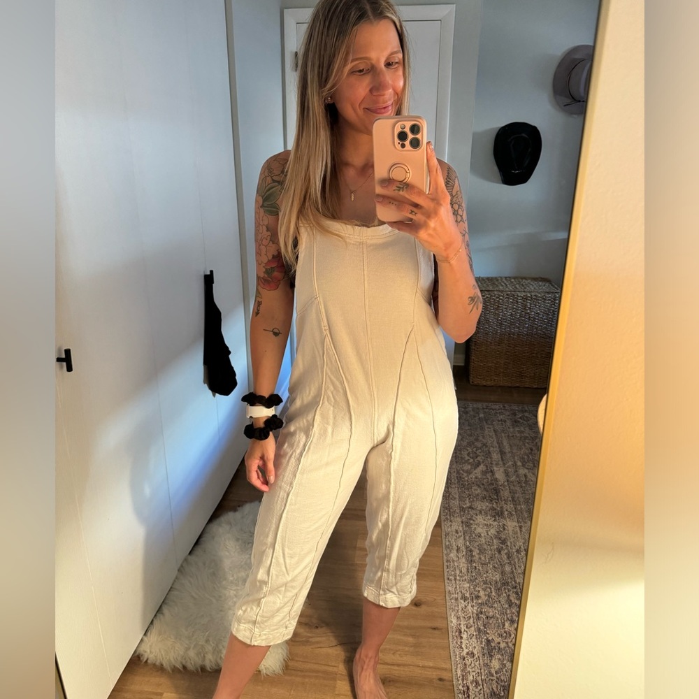 Cream cotton jumpsuit with seaming detail